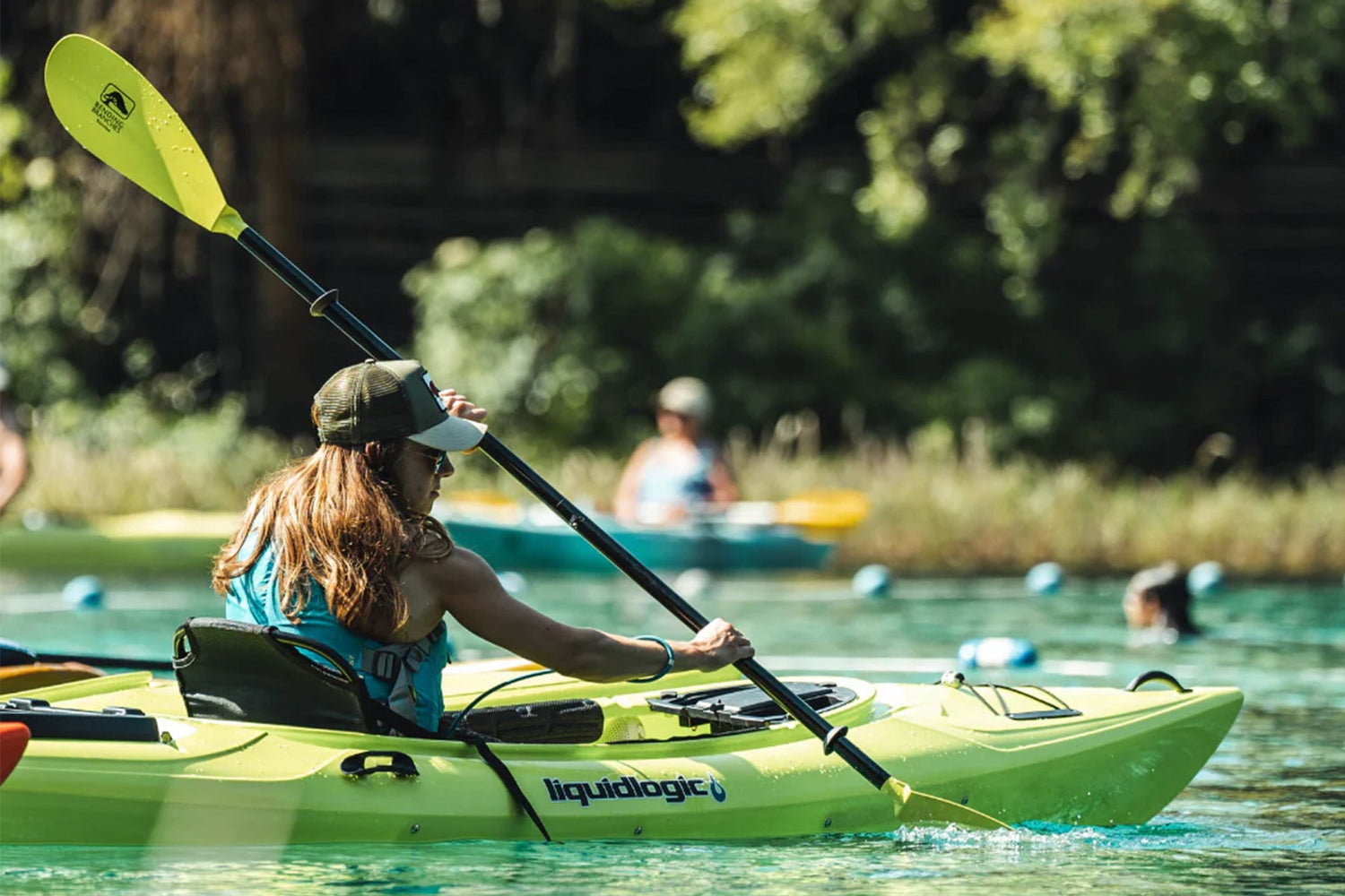 Women kayaking in Liquid Logic Saluda with Bending Branch paddle